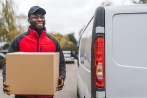 delivery man is delivering something as a small business