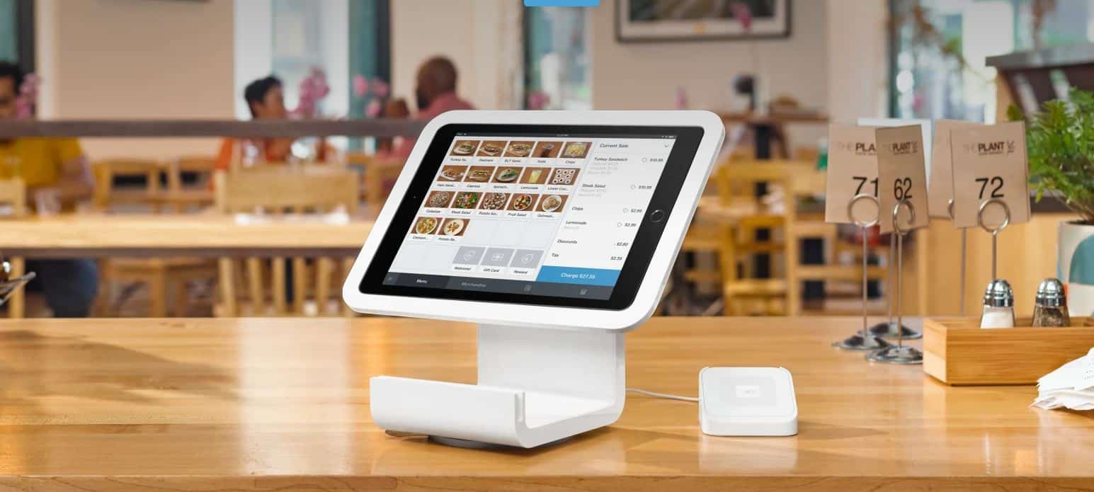 Square iPad stand and card reader sitting on a cafe counter