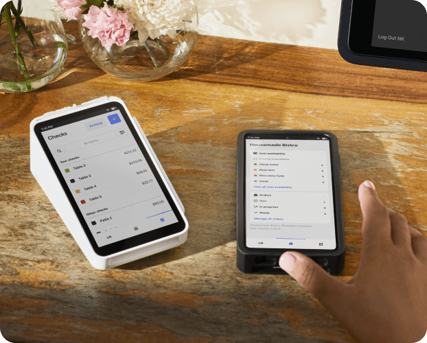 Square Terminal credit card reader connected to Square POS app on a smartphone