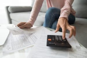 woman working on her erc loans paperwork.