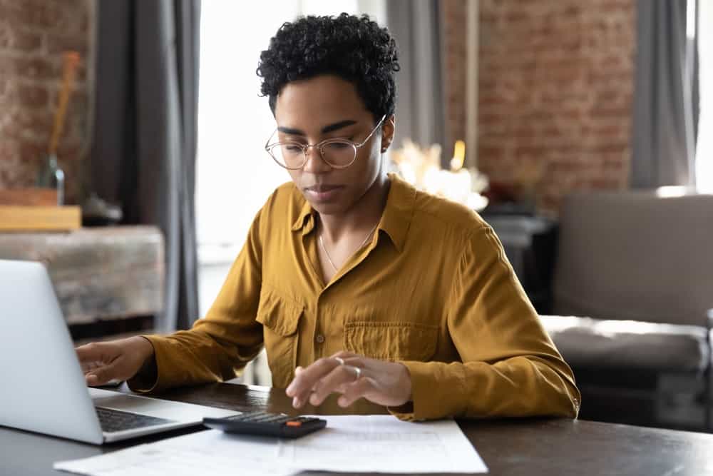 Woman does her taxes and checks to see how the ERC affects her.