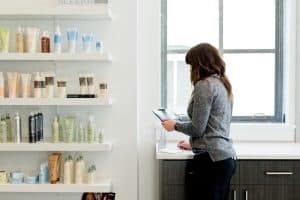 woman using a pos system at a salon